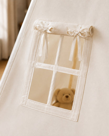 Canvas window detail with fabric ties, teddy inside