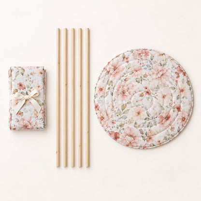 What comes in the box: folded canvas, five pine poles and the round padded mat