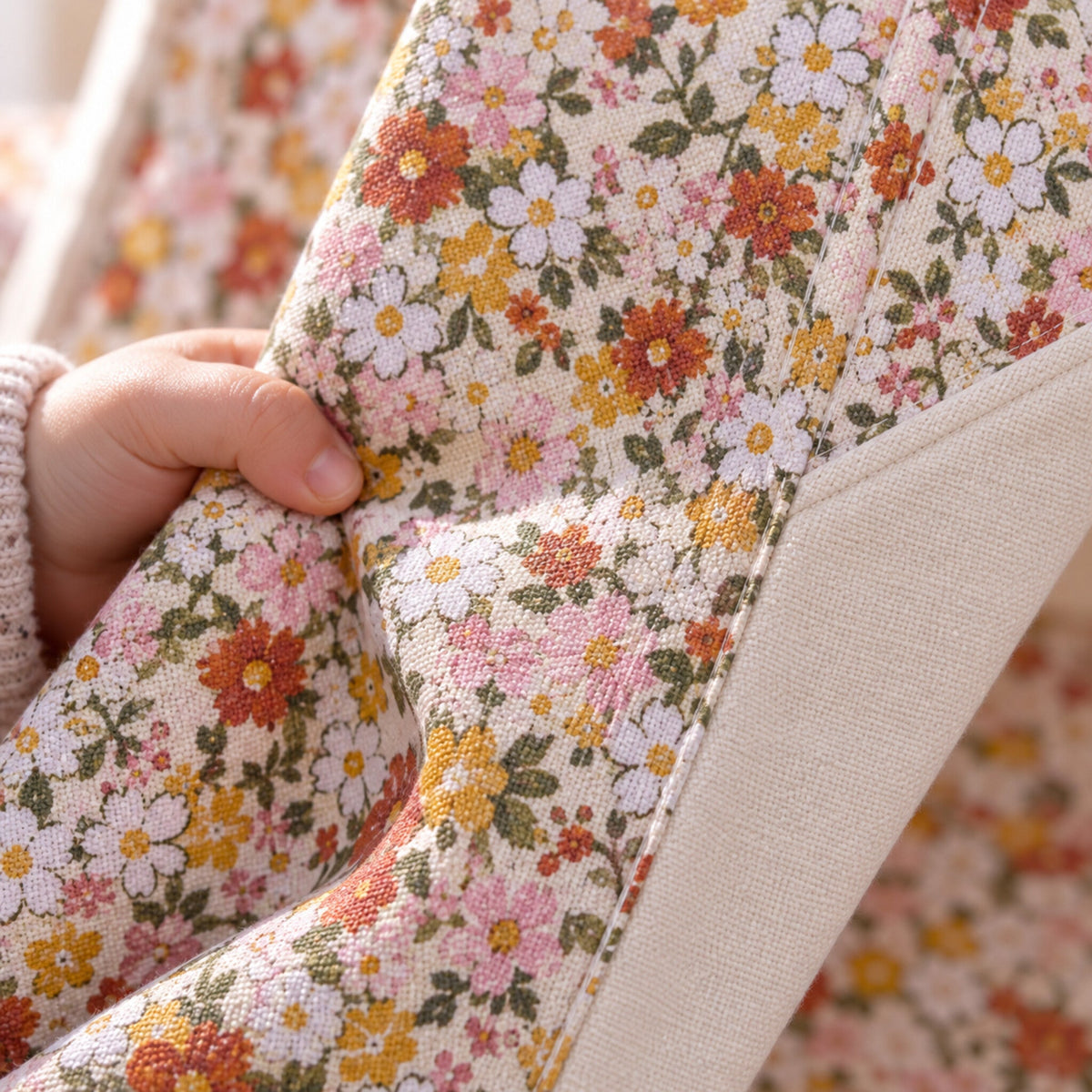 Close-up of the Green Garden floral print and plain cream panel