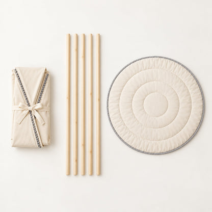What comes in the box: folded canvas, five pine poles and the round padded mat