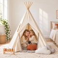 Grey Pompom kids teepee set up in a child's bedroom