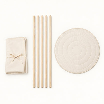What comes in the box: folded canvas, five pine poles and the round padded mat