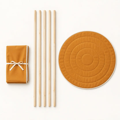 What comes in the box: folded canvas, five pine poles and the round padded mat