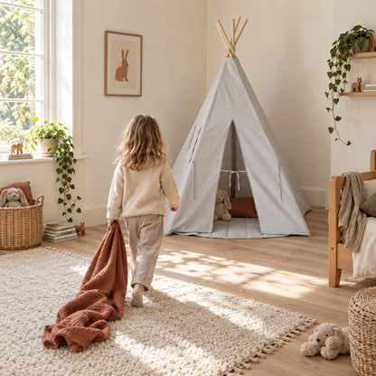 Child walking towards the Pigeon Grey Linen kids teepee