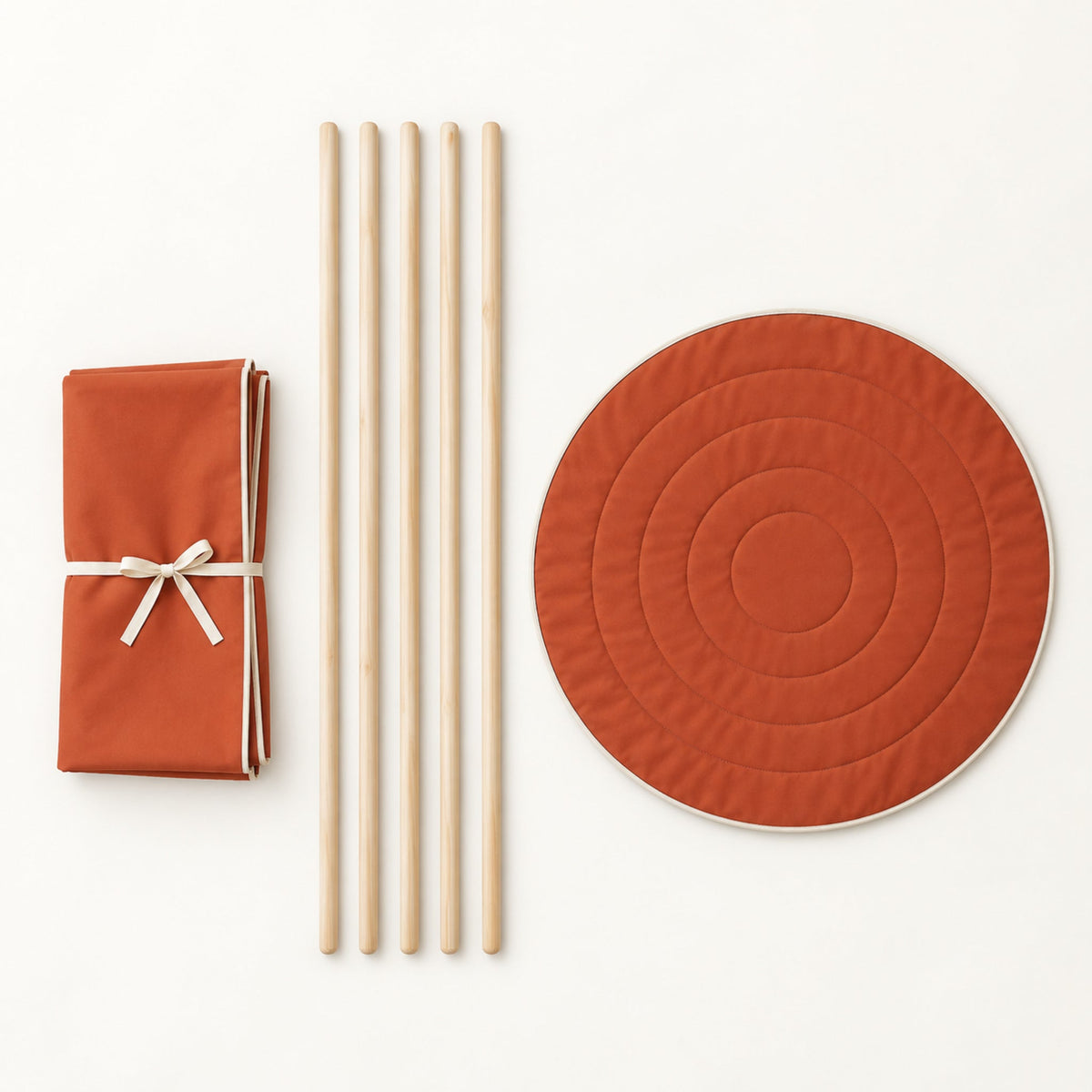 What comes in the box: folded canvas, five pine poles and the round padded mat