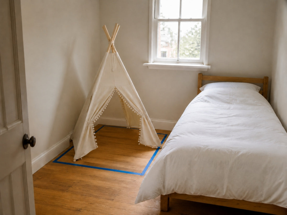 Kids teepee in a UK box room next to a single bed, 110 cm square marked on the floor